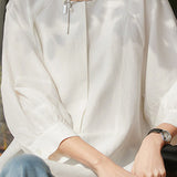 Lantern sleeve round neck shirt with hidden button half placket