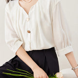 Solid color asymmetric button-up shirt